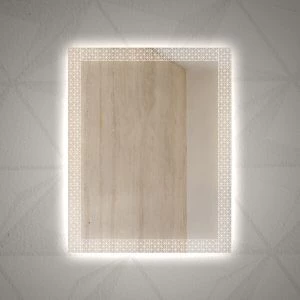 An abstract geometric design in a backlit mirror on a ceramic tiled wall.