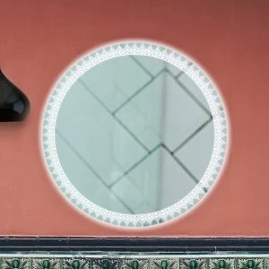 A mandala-designed LED frame in a backlit circle-shaped mirror on a red wall.