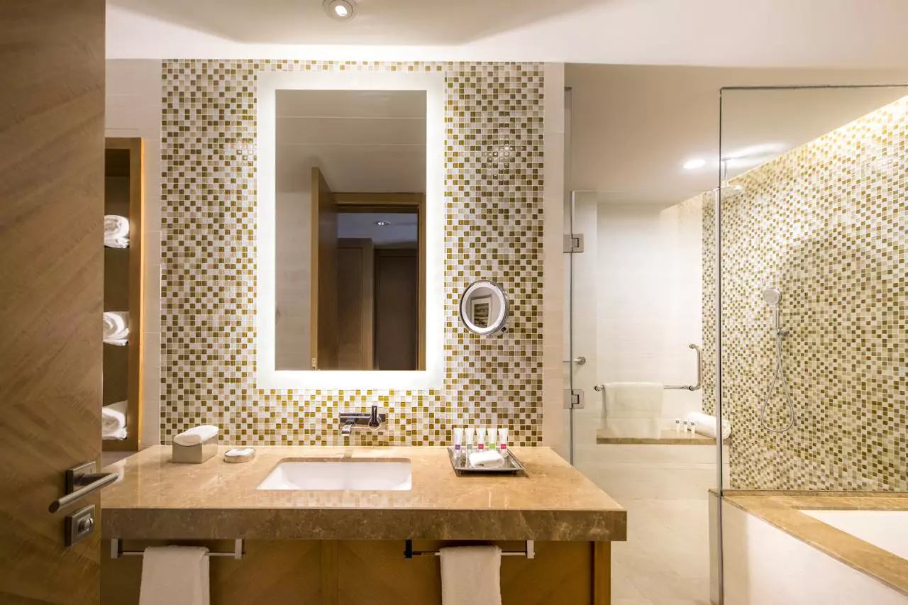 An elegant bathroom featuring a custom frosted mirror and a stylish sink in Adelaide.