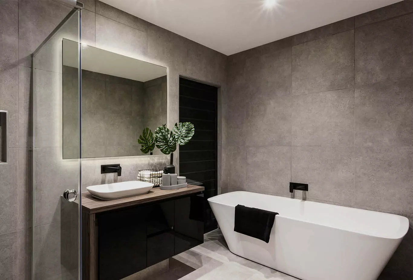 Bathroom with a bespoke backlit mirror, showcasing a minimalist design in Darwin.