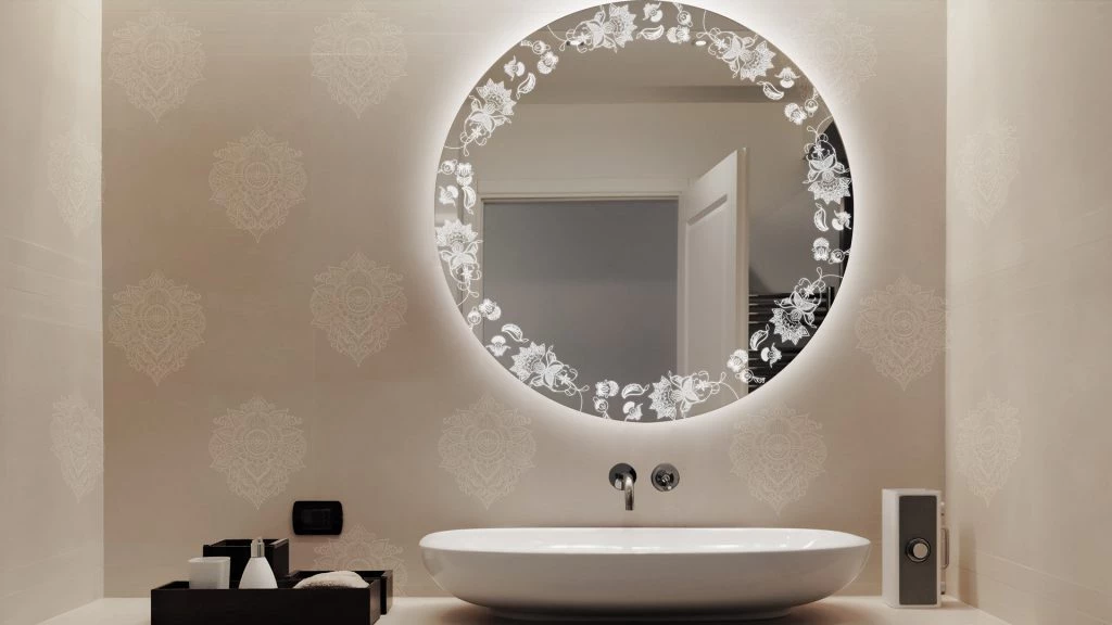 A bathroom with a large bathroom mirror with lights positioned above the sink in Victoria.