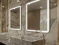 Two elegant sinks in a luxurious bathroom with marble walls and sleek mirrors in Canberra preview.