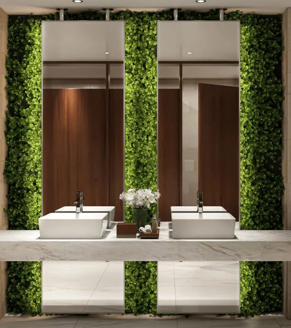 A bathroom with two sinks and a lighted mirror in a ceiling mount in Queensland.