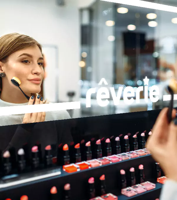 Compact of woman doing makeup in front of the mirror with custom LED light logo in Victoria.