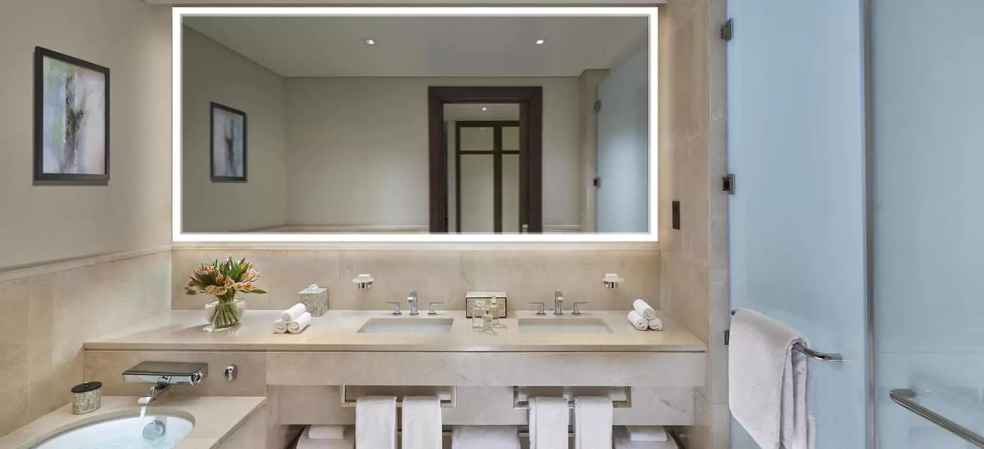 Contemporary bathroom designed with a custom lighted mirror and sink in Newcastle.