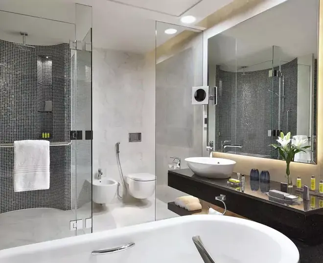 A bathroom featuring a custom backlit mirror, offering a relaxing bathing experience in Brisbane.