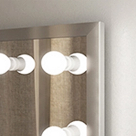 A mirror with an LED bulb light in a stainless steel frame.