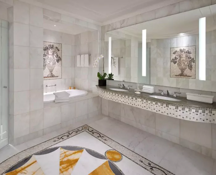 Modern bathroom with a large wall mounted lighted double sink mirror in Sydney.