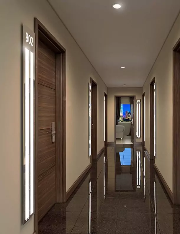 Customized mirrors with light bars installed in hotel hallways in Brisbane.