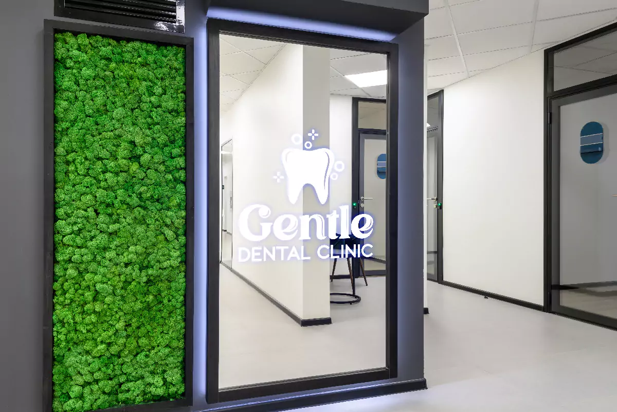 Illuminated logo reflected in a mirror tailored in a dental clinic in Wellington.