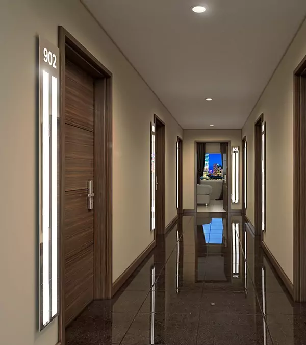 LED light strips beside a wooden door in a fancy and luxurious hotel hallway in Darwin.