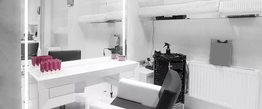 Beauty studio featuring a trolley cart and an illuminated full-length mirror in Gold Coast.