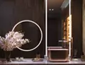 Two LED custom mirrors in Melbourne installed in a luxurious bathroom snippet.