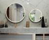 A thumbnail of Melbourne luxurious bathroom with a stunning circular gold mirror.