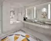 Mini of elegant bathroom featuring marble flooring and a spacious illuminated mirror in Brisbane.