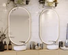 A thumbnail of contemporary bathroom in Sydney with two sinks and oval custom lighted mirrors.