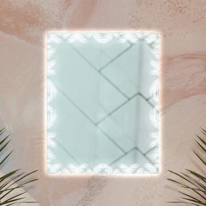 A palm leaf frame design in a backlit mirror mounted on a pastel wall.