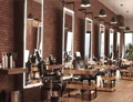 Perth chairs and trolleys in front of each salon mirrors mounted on a brick wall in compact.