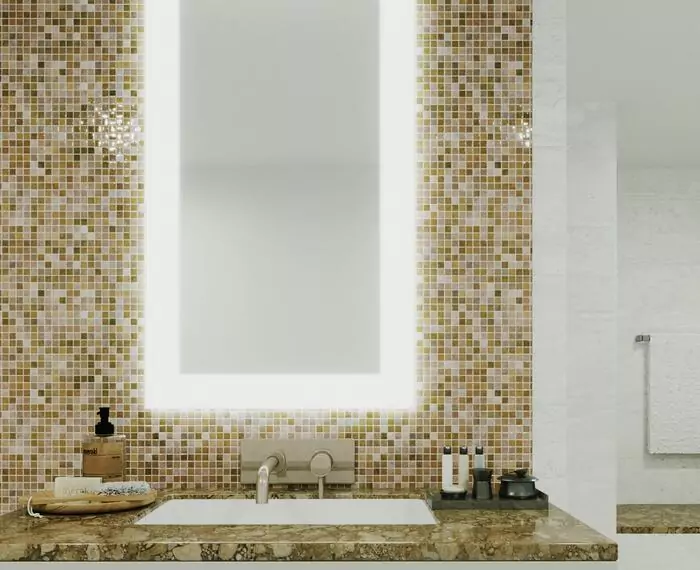 A bathroom with a spacious lighted mirror and colorful mosaic tiles in Lismore.