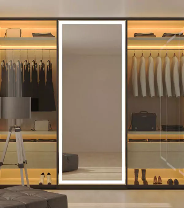 A preview of modern closet with a light framed mirror and neatly arranged clothes in Gold Coast.