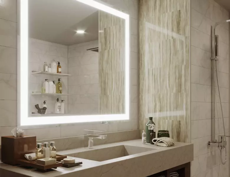 A modern bathroom with a generously sized lighted mirror and a sink in Newcastle.