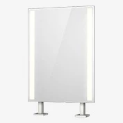 A snippet of a countertop-mounted lit mirror in a white space.