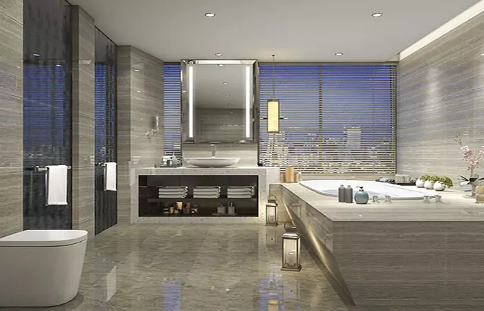 Bathtub with an illuminated mirror installed above a single white washbowl in a modern bathroom.