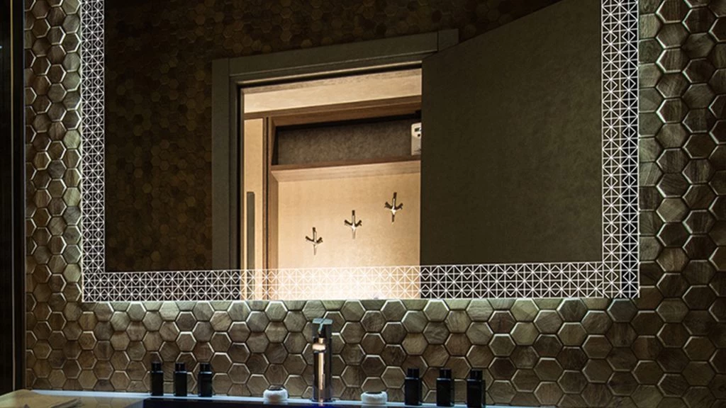 Bathroom with a sink and mirror with lights, showcasing contemporary style and functionality in Canberra.