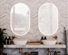 A thumbnail of Tasmania contemporary bathroom featuring dual sinks and oval aluminium framed mirrors.