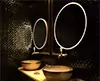 Thumbnail of dark themed bathroom with two sinks and rounded mirrors in Sydney.