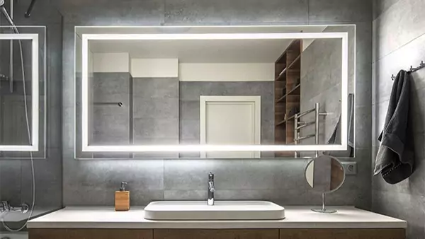 Thumbnail of bathroom interior in Perth featuring a shower, a large lighted mirror and a sink.