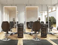 Tiny modern salon interior with comfortable chairs and sleek illuminated mirrors in Adelaide.