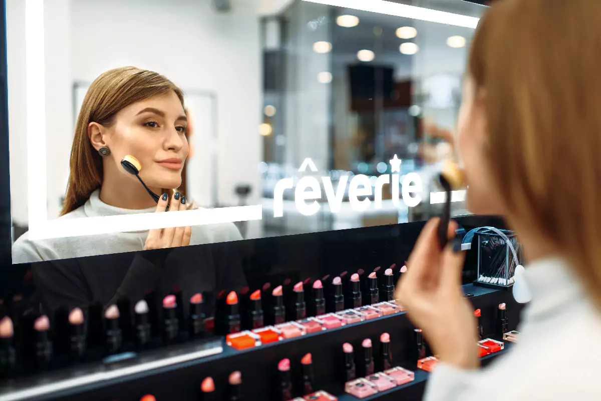 Woman doing makeup in front of the mirror with custom LED light logo in Adelaide.