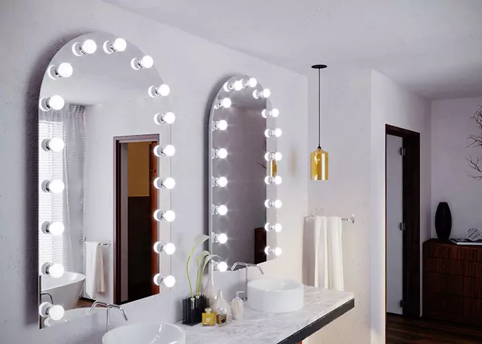 Double sink arch shaped hollywood mirror installed on a white wall in Victoria.