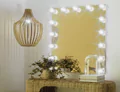 Thumbnail of a rattan vanity with a lighted Grand Mirrors Hollywood and modern pendant light in Victoria.