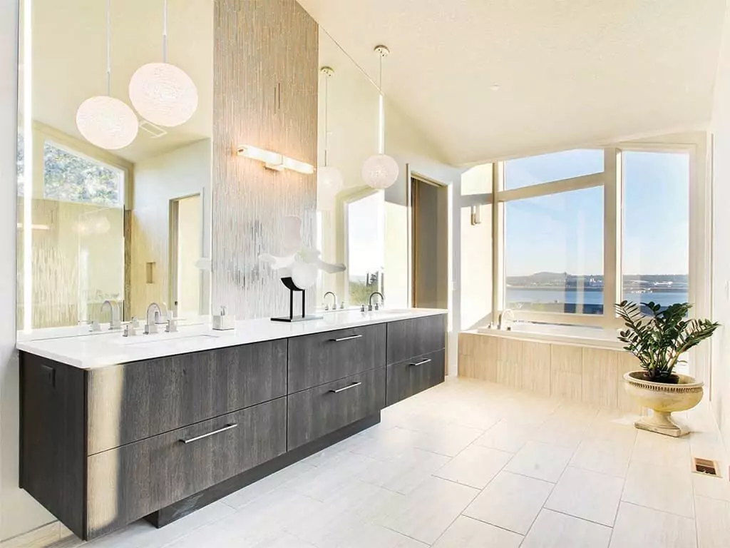 An expansive bathroom showcasing a large window, accompanied by a lighted mirror in Gold Coast.